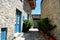 Narrow Greek Cyprus Street - White houses with blue door