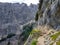 Narrow hiking pathway on rocky hills under the sunlight in the countryside