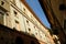 Narrow historic street in Foligno with flags on the facades of the houses. Glimpse in the historic center of the Umbrian town with