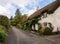 Narrow lane in the pretty Devon village of Dunsford Devon