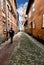 Narrow lanes of brick buildings in the historic old town of the Hanseatic city of LÃ¼neburg with unrecognizable persons