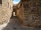 Narrow and lonely medieval street in Baeza, Jaen, Spain