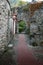 Narrow medieval alley with arch, in the town of Levanto, Italy.