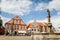 Narrow medieval square with baroque and renaissance historical buildings and Knight Ronald on fountain, cityscape of medieval town