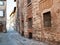 narrow medieval street with old house in Brescia