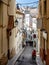 Narrow medieval street in Old Sitges, historical resort-city close to Barcelona