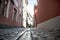 Narrow medieval street in the old town of Vilnius, Lithuania. narrow street with paving stonesnia.