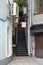 Narrow metal staircase to a small cozy shop