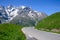 Narrow mountains road from Col de Lautaret to Col du Calibier, Mountains and alpine meadows views of Massif des Ecrins, Hautes