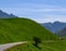 Narrow mountains road from Col de Lautaret to Col du Calibier, Mountains and alpine meadows views of Massif des Ecrins, Hautes