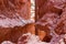 Narrow Navajo hiking trail through massive cliffs of hoodoo sandstone rock formation in Bryce Canyon National Park, Utah, USA