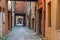 Narrow old street in the historic centre of Ferrara, Italy