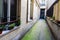 Narrow outdoor passage in the yard near modern building i France