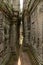 Narrow passage between leaning walls of temple