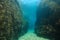 A narrow passage between rocks underwater sea