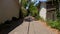 narrow paved road beautiful vintage homes in Florida wooden sheds