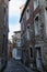 Narrow road with cobblestone pavement and historic buildings in Stolberg, Eifel