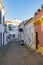 Narrow road in old town of Lagos with colorful small historic fishermens houses