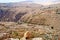 Narrow road to Wadi Bin Ibn Hammad Jordan, deeply eroded into the rocks