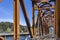 Narrow rusty powerful metal railway bridge across the Columbia River in a scenic Columbia Gorge