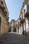 Narrow scenic street in Ragusa, Sicily, Italy with old townhouse