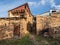 Narrow shady streets of a mountain village. Old mountain village in Dagestan. Rural clay and stone houses in a village in Kakhib