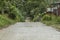 A narrow single-lane concrete road. At a remote mountain barangay in Bohol, Philippines