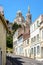 A narrow sloping street going up to Notre-Dame de la Garde basilica in Marseille, France