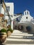 Narrow stairs uphill in a narrow street of Naxos in Greece.