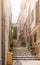 Narrow steep alley with steps in historic spanish village