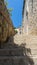 narrow stone stairs between old residential area in croatia. Adriatic coast village with stone houses and Old stone street of