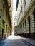 Narrow street alley with classic buildings and arched windows in Budapest