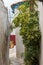 Narrow street in ancient residential district of Anafiotika in Athens Greece