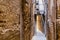 Narrow street of Arabic old town called medina in Fes, Morocco, Africa