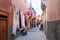 Narrow street with carpet shop in old town of Marrakech, Morroco