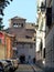 Narrow street in the Celio district with at the end the medieval church of S.s quattro Coronati to Rome in Italy.