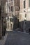 A narrow street in the city of Rome, the road of cobblestones and old houses