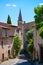 Narrow street with cute houses an church in Saint Saturnin lÃ¨s Apt Provence