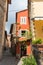 Narrow street and facade fragment of typical Italian house, Tuscany, Italy
