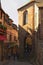 Narrow street with first tourists. Ancient buildings of the old town on the famous Mont Saint Michel island