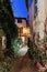 Narrow street with flowers in the old town Mougins in France.