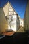 Narrow street with half-timbered houses listed as monuments in Greifswald, Germany