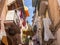 Narrow street with hanging clothes on balconies in south of Italy, Bari. Drying laundry on balcony. Italian southern architecture.