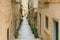 Narrow street of historical center Birgu or Vittoriosa, Malta