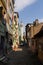 Narrow street in Istanbul`s historic district. View of the minaret of the ancient  Akbiyik Mosque . Turkey