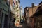 Narrow street in Istanbul`s historic district. View of the minaret of the ancient  Akbiyik Mosque . Turkey