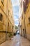 Narrow street with lantern and arch in Bari, Italy. Italian south landmark. Ancient european architecture. Mediterranean cityscape