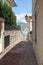 Narrow street leading to the harbor of the peninsula of Saint-Jean-Cap-Ferrat on the Cote d `Azur in France