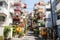 a narrow street lined with multi-colored buildings in tokyo japan