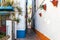 Narrow street of Marbella town with white walls decorated with flower pots